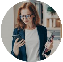 elegant smiling woman office worker in eyeglasses using modern mobile phone in coworking space 300x200 1