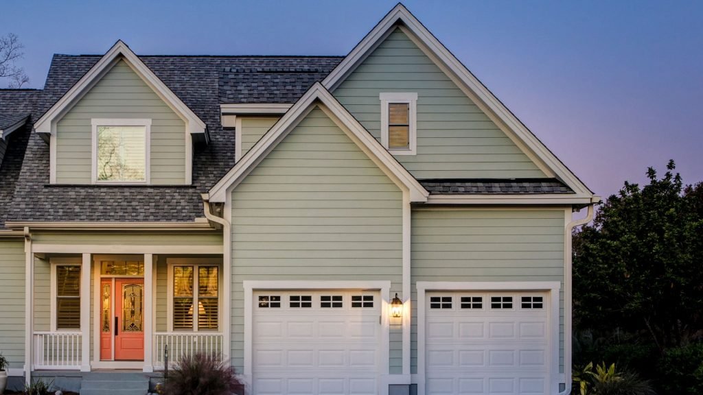 home with garage doors at dusk 1920x1080 1 1 1 1024x576 1