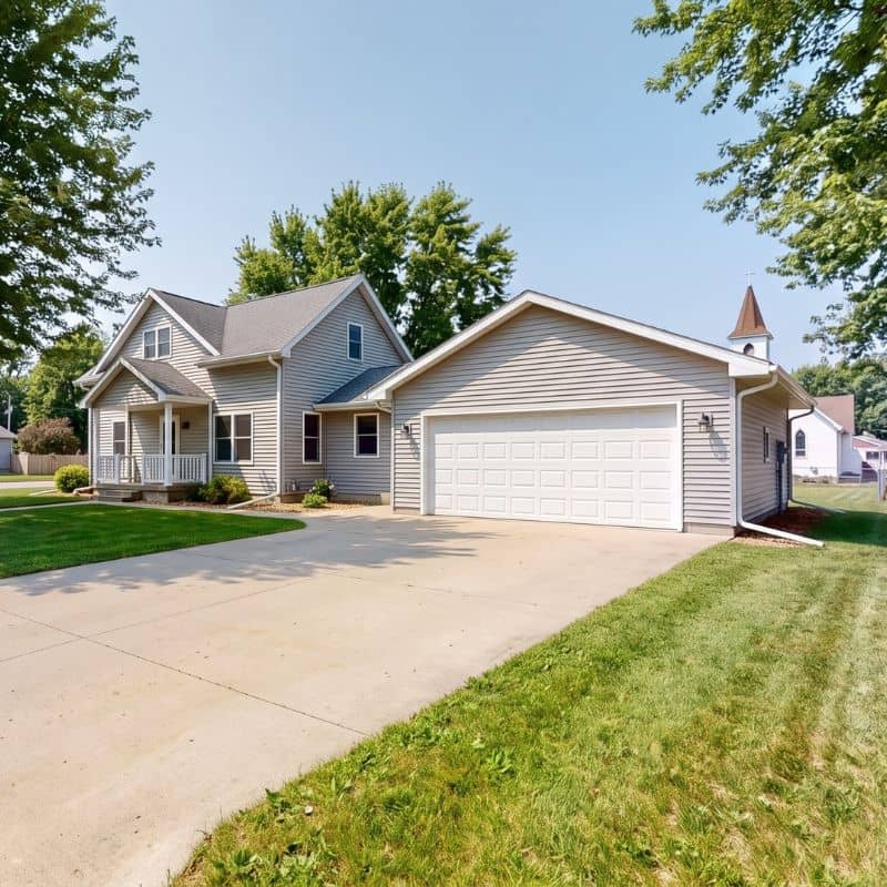 White double garage door serviced by After Hours Garage Doors in Roscoe, MN